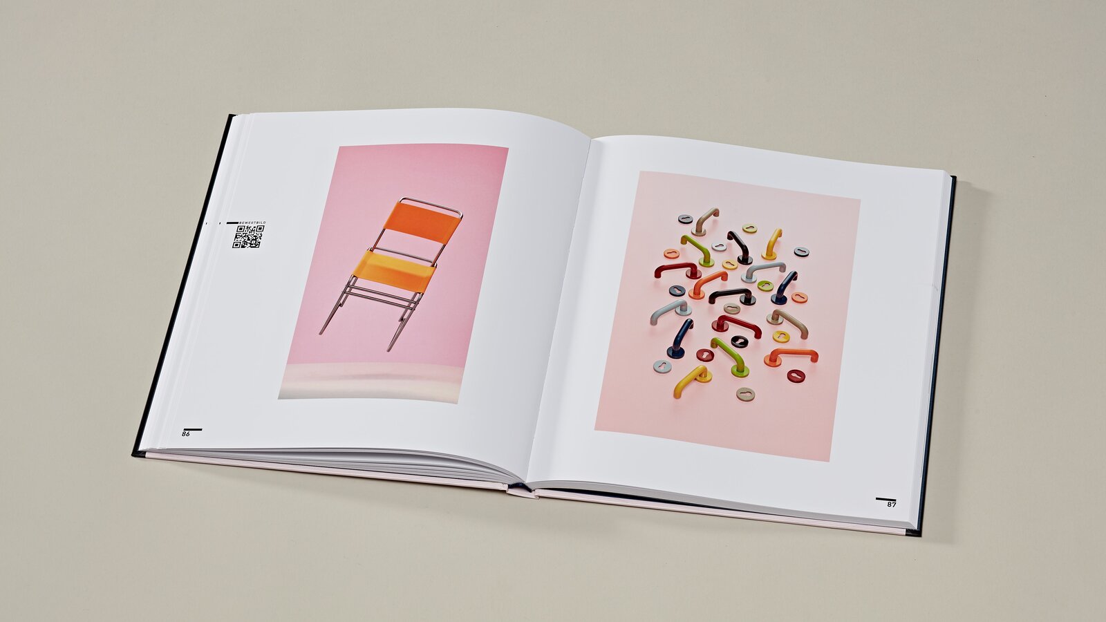 Re:Form Art volume Bauhaus 2 open pages of the art book on the Bauhaus exhibition right HEWI lever handle 111 in 8 colours, left orange chair