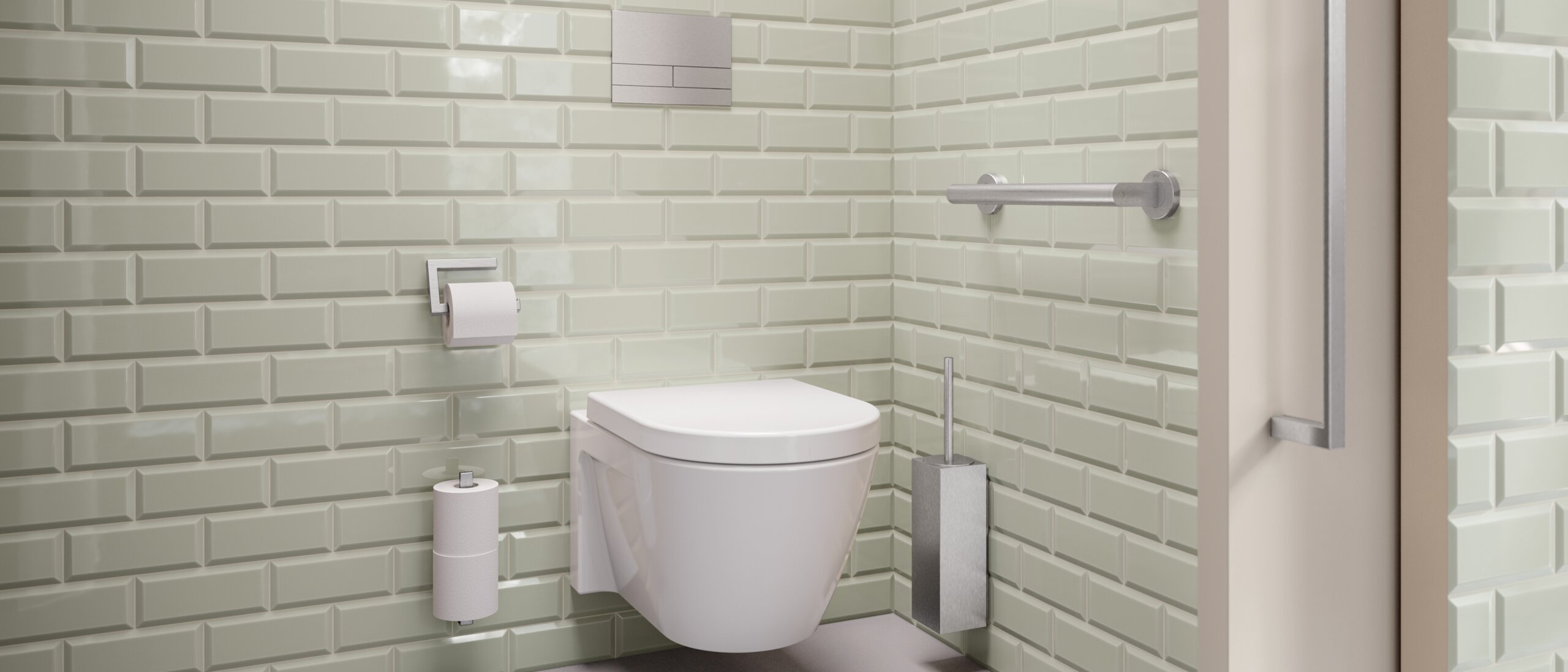 Espace WC équipé d'un porte-brosse, d'un porte-papier toilette et d'une poignée en inox mat